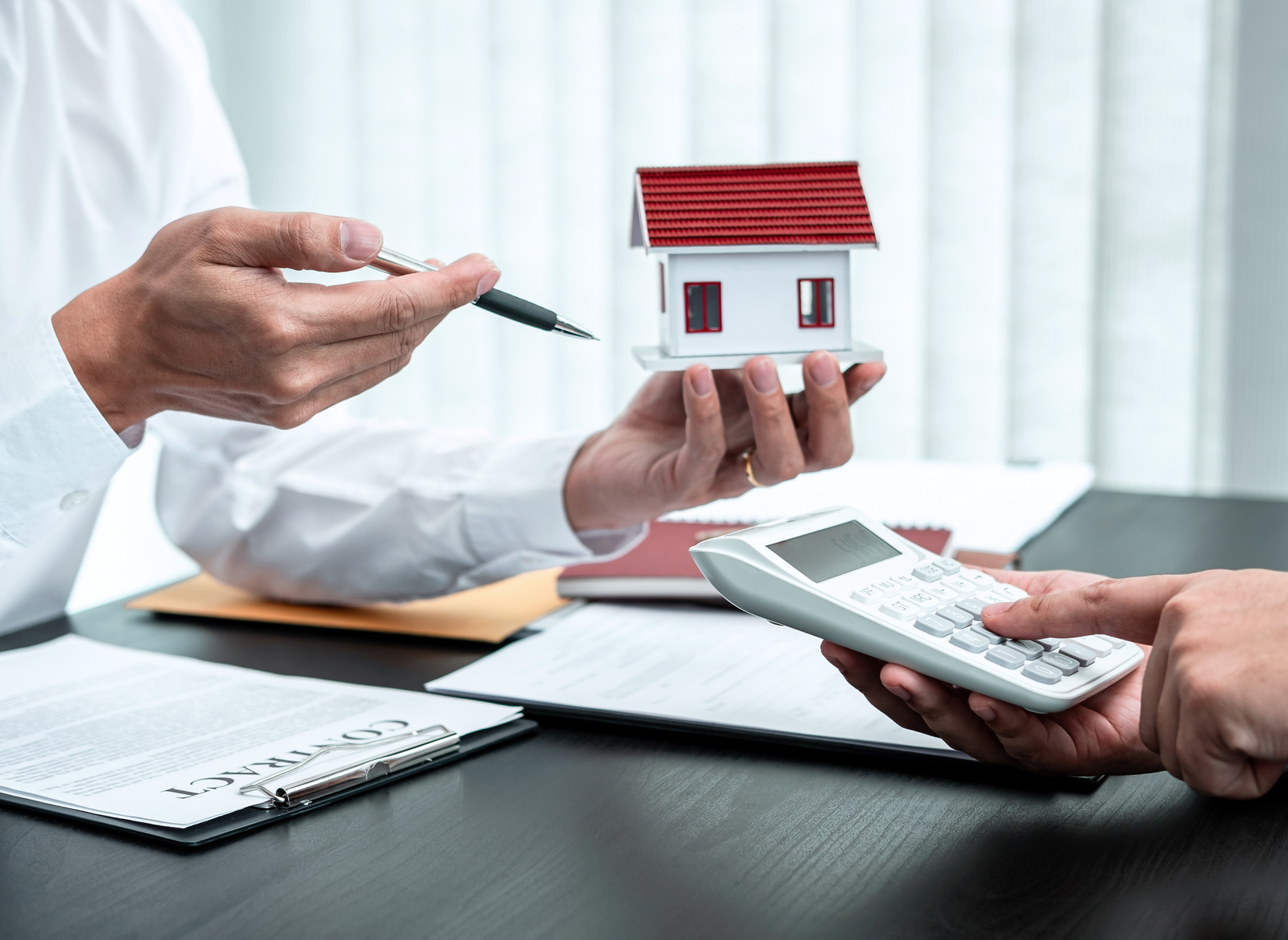 Realtor Presenting Home Loan to Client 
